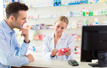 Pharmacist and client at pharmacy