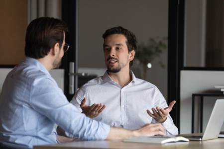 Employee arguing with employer about new employee being paid more