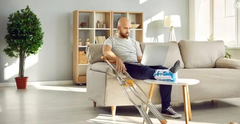 Man at home with cast on his foot.